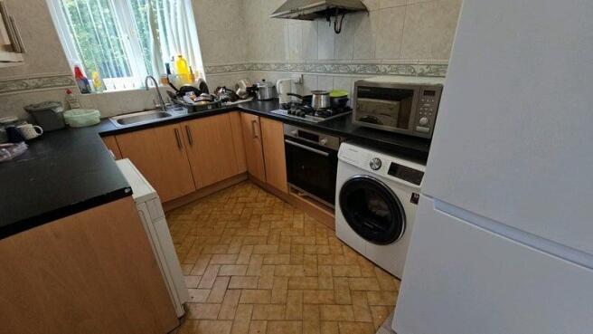 Bright kitchen with modern laundry facilities...