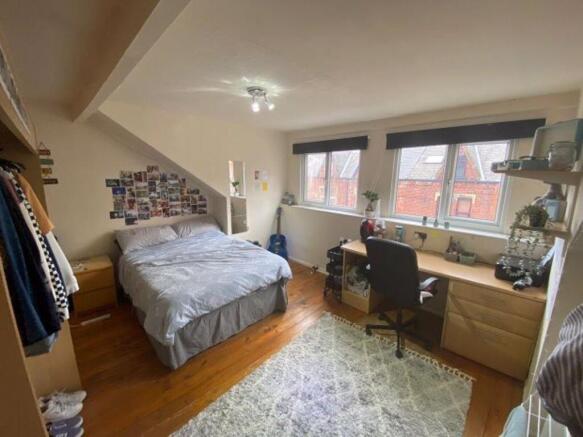 Bright and cozy double bedroom featuring a comf...