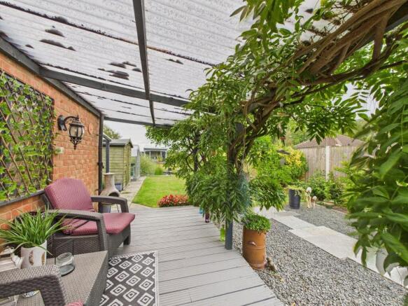 Covered seating area by the garage