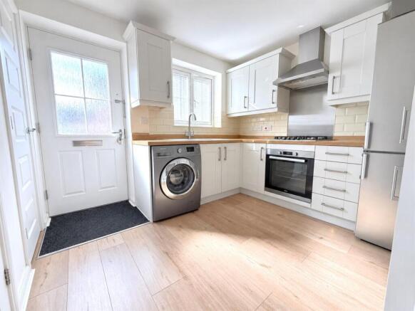 Bright Decluttered Modern Kitchen Interior.jpg