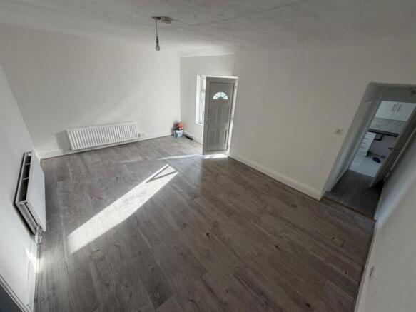 Bright and spacious lounge with wood flooring...