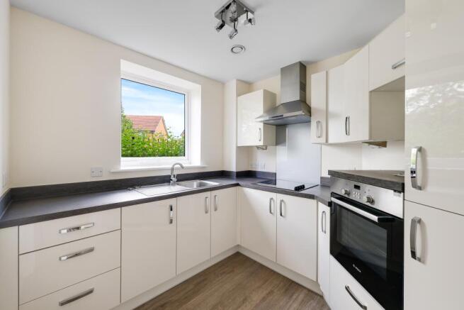a kitchen with white cabinets