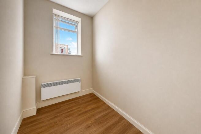 Bright storage space with wood-style flooring...