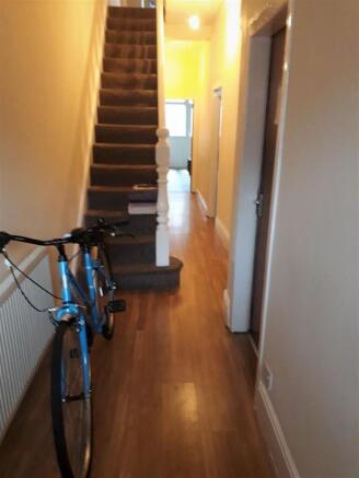 Bright and welcoming hallway with stylish floor...