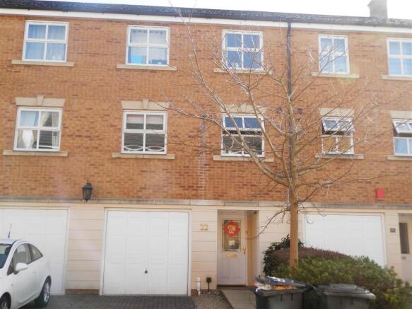 Modern brick townhouse with garage and parking...