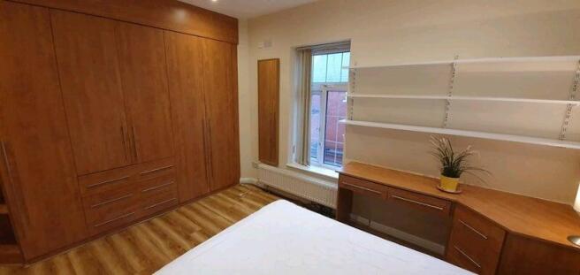 Bright room with built-in storage and desk...