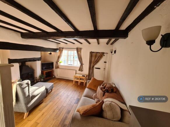 Living Room With Inglenook Fireplace & Beams