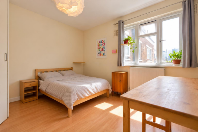 Sunlit Minimalist Bedroom Retreat.png
