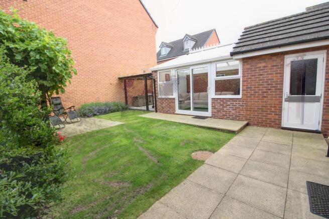 Garden room, BBQ area and garage