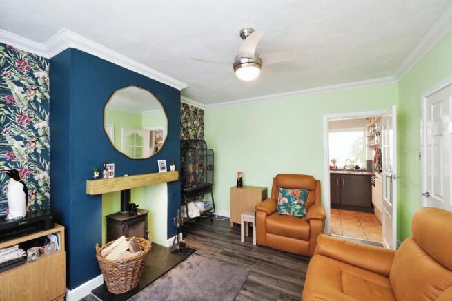 Tastefully decorated lounge with cosy log burner