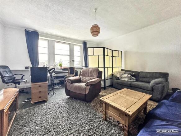 Spacious living area with excellent natural lig...