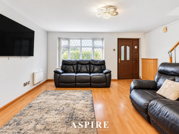 Bright Luxury Living Room with Aspire Branding.png