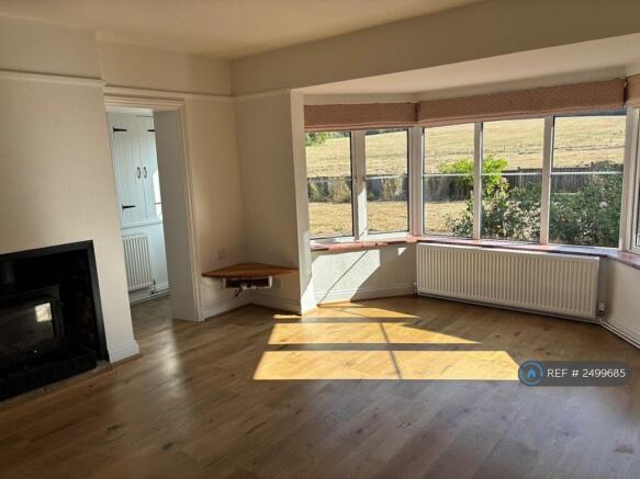 Sitting Room With Stove And Gorgeous Views