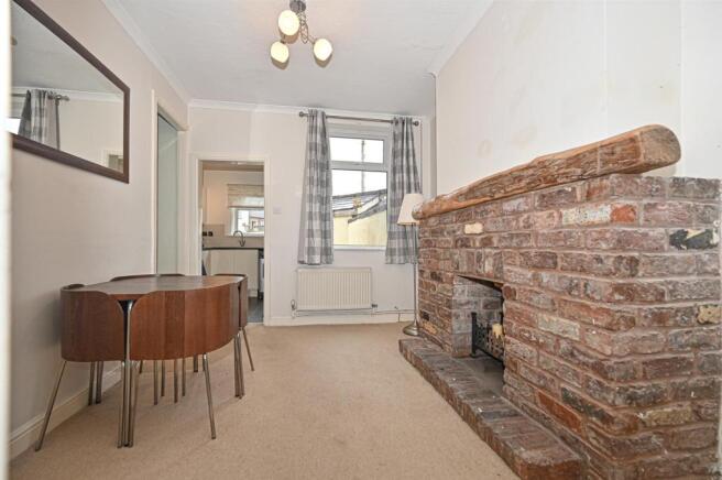 Reception/dining room with under stairs cupboard