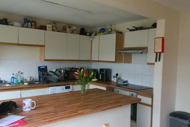 Bright kitchen with a stylish wood island...