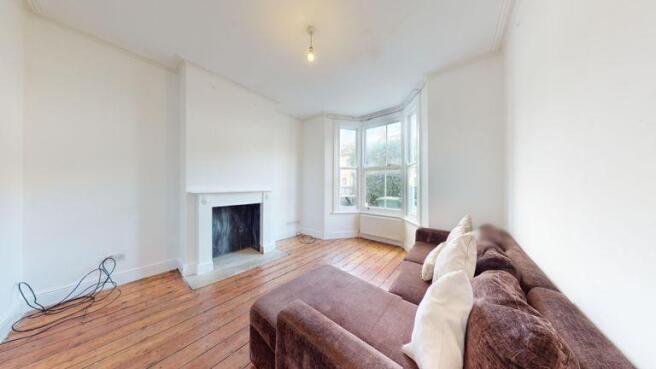 Wooden flooring in reception into bay window