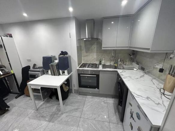 Modern grey kitchen with sleek marble counters...