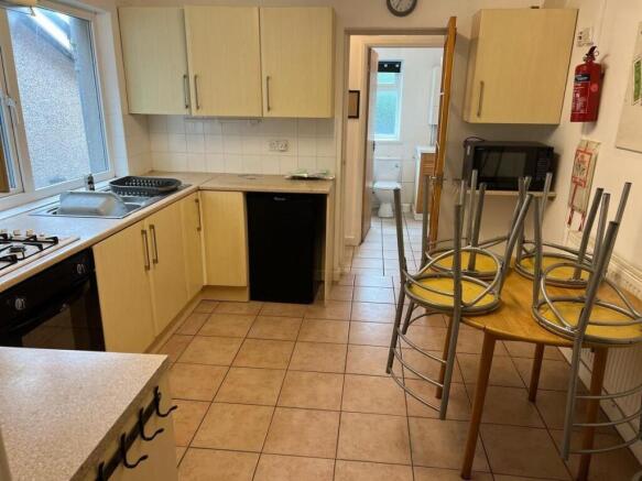 Spacious kitchen with a dining area and window...