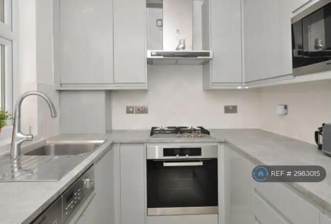 Kitchen With Miele Oven, Washer/Dryer