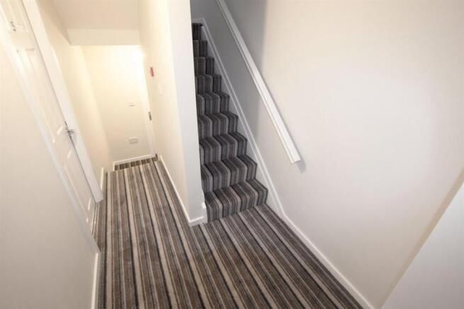 Bright, recently refreshed hallway with pattern...