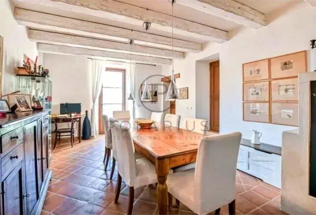 Spacious dining area with a wooden table and comfo