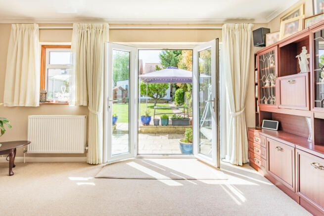 DOUBLE DOORS LEADING TO THE GARDEN