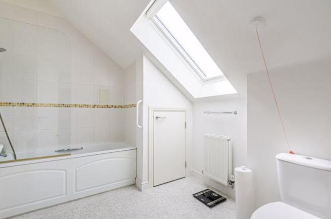 Bathroom with over-bath shower