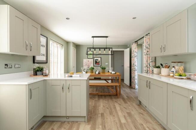 The large open plan kitchen/breakfast area features double doors to the rear garden