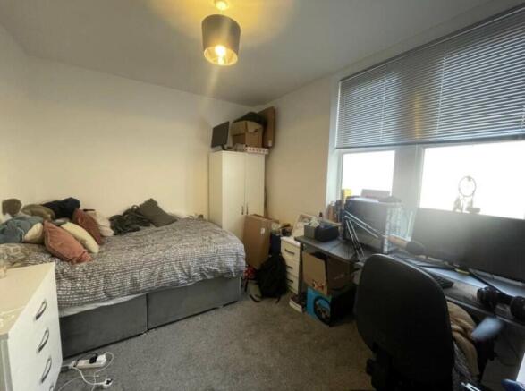 Bright, practical double bedroom with a large w...