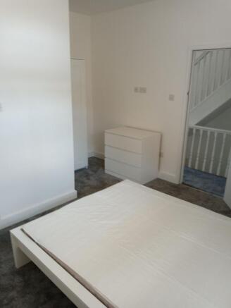 Bright modern bedroom with ample storage space...