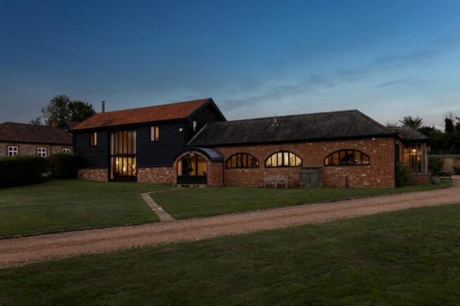 Front View - Mill Farm Barn at Dusk