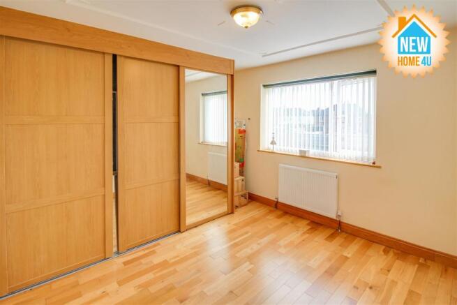 SECOND BEDROOM: