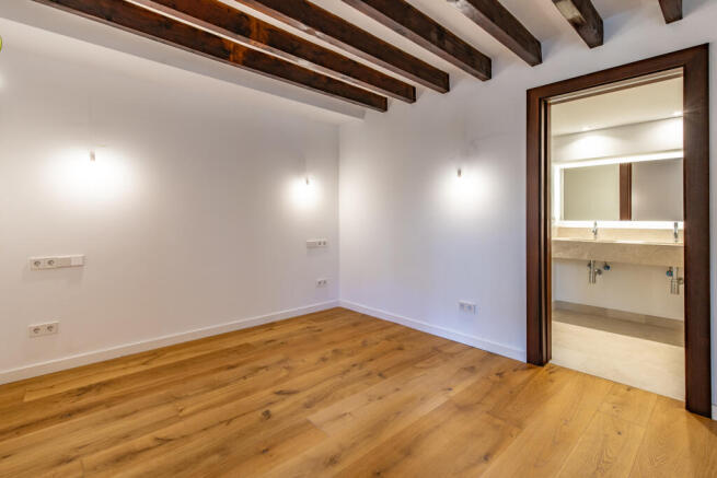 Master bedroom with an en suite bathroom