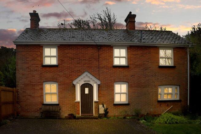View of property at dusk