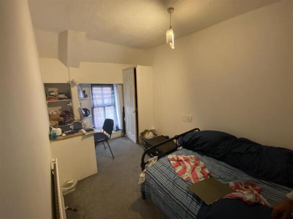 Spacious bedroom with a dedicated study area....