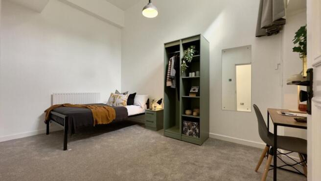 A stylish and well-lit double bedroom with mode...