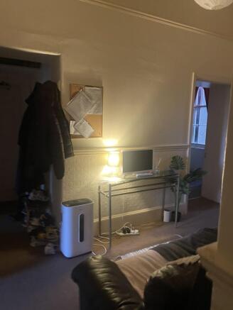 Cosy living area with a leather sofa, console t...