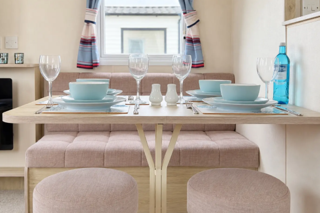 Dining area with fitted seating in the ABI Summer