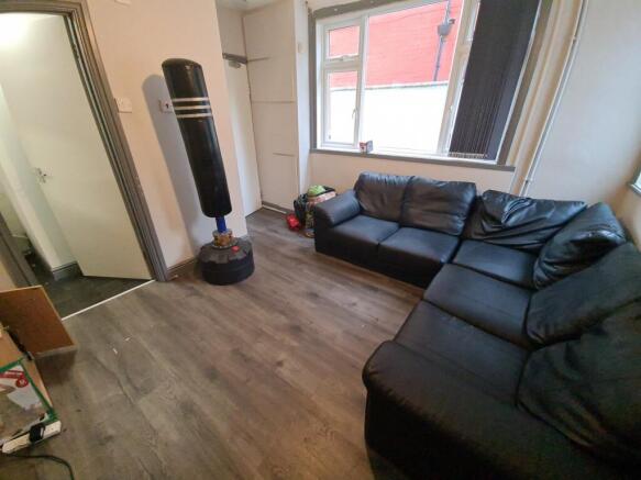 A spacious and comfortable living room with a m...