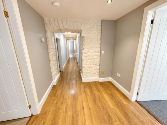 Bright Stone-Arch Hallway Perspective.png