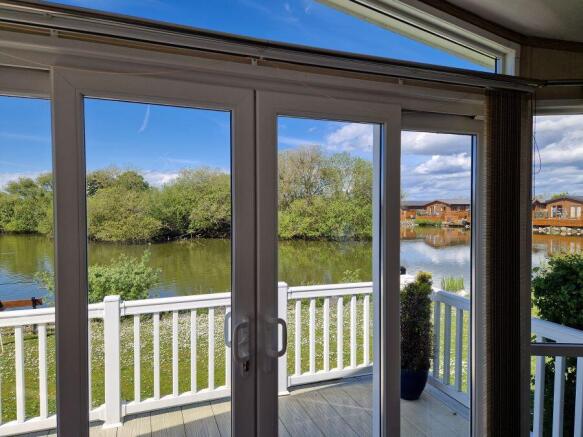 Lakeside View Through The Lodge's Patio Doors
