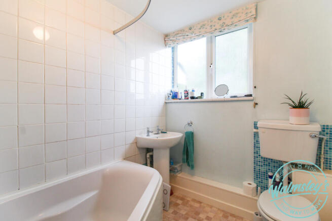 Three piece bathroom with corner bath