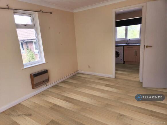 New Floor, Old Gas Heater Replaced With Radiator