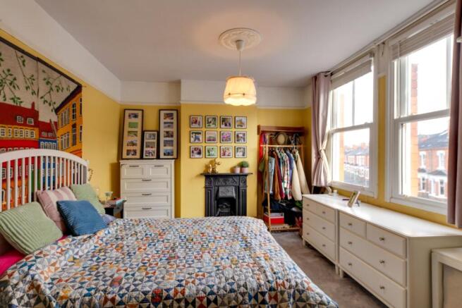 View of Fireplace in large main Bedroom