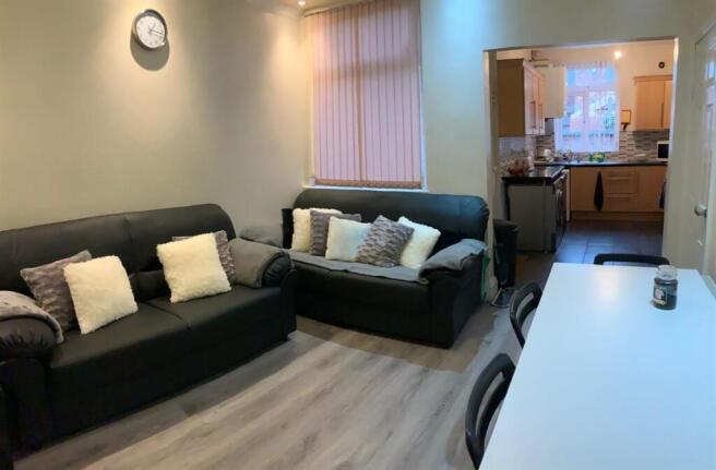 Neat, modern living room with two comfortable s...