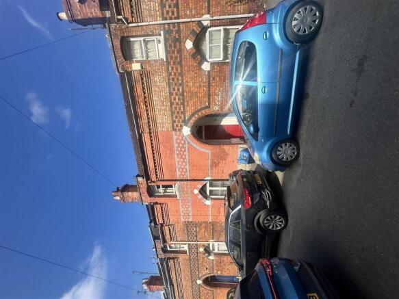 Charming red brick home on a sunny street...
