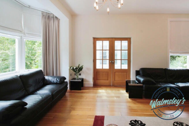 Sitting room with doorway to Orangery