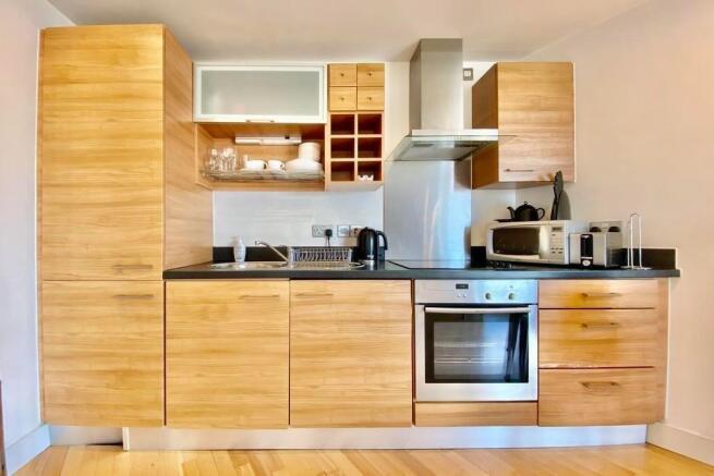 Modern fitted kitchen with stylish wood cabinet...