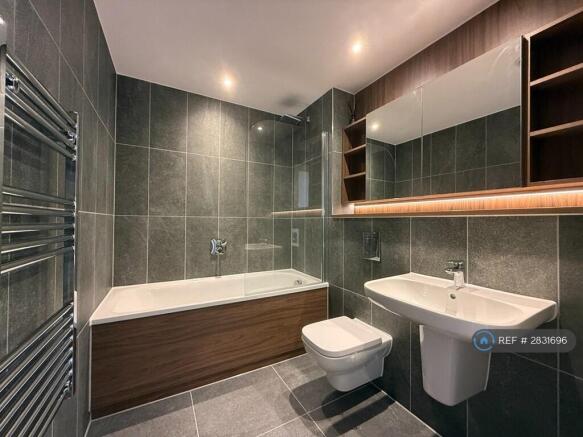 Fully Tiled Bathroom With Rainhead Shower