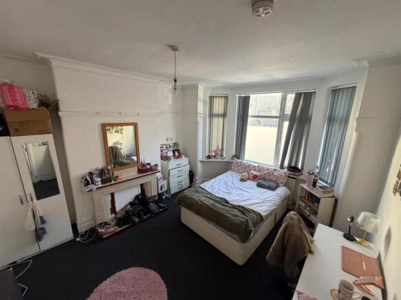 Bright master bedroom with large bay window...